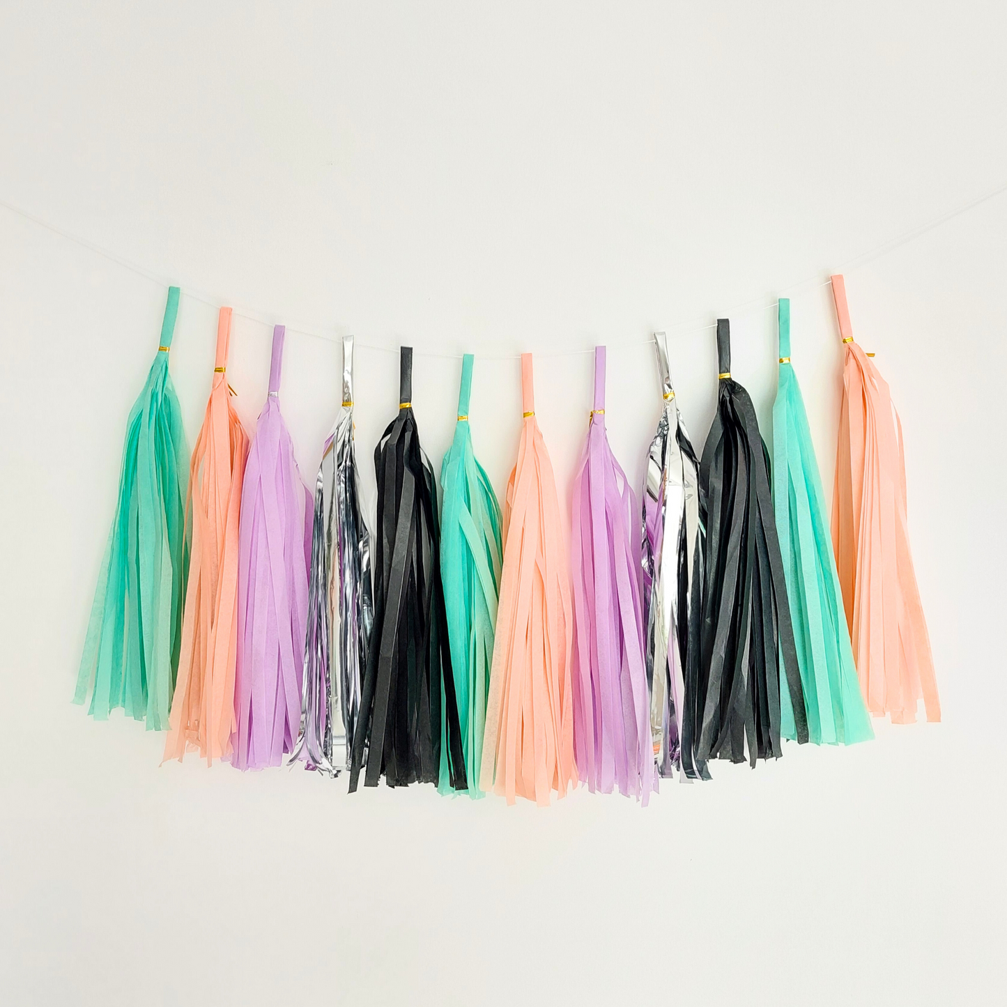 Pastel Orange Green Black tissue tassel garland - TheLittleStuff