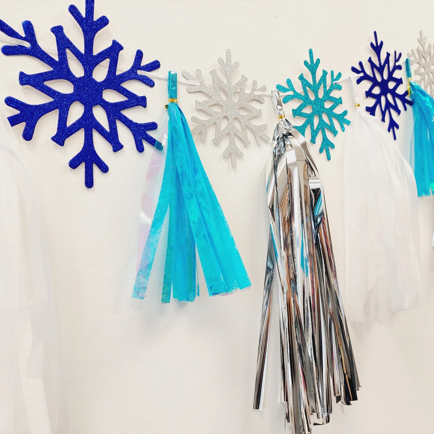 Winter Christmas Frozen princesses blue white snowflakes tissue tassel garland - TheLittleStuff