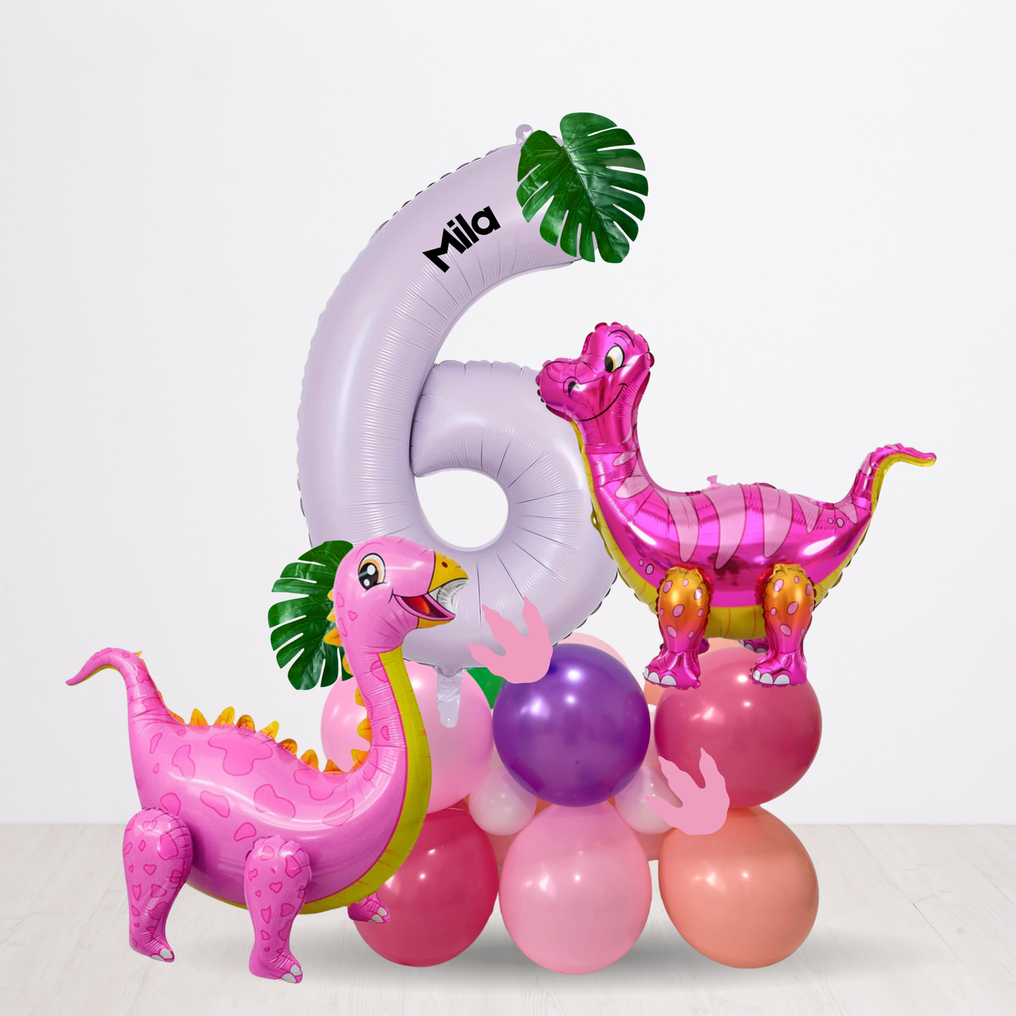 Inflatable dinosaur balloons with a large number '6' and the name 'Mila' on a white background.