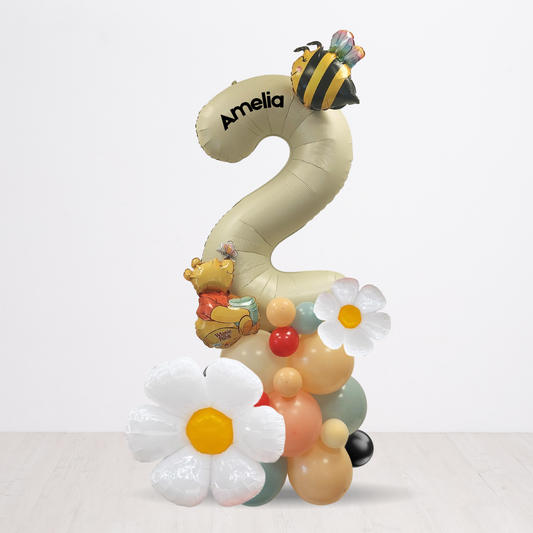 Balloon sculpture shaped like the number '2' with a bee and flowers on a white background