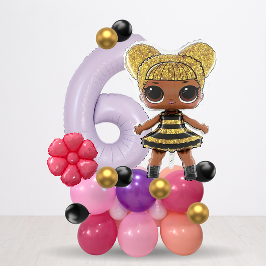 Decorative number '6' made of balloons with a doll in a bee costume on a white background